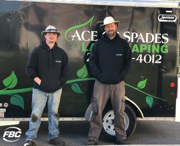 Marty hammond stands in front of his van, Ace of Spades Landscaping